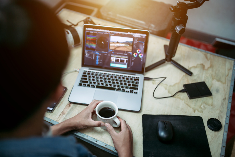 Content creator desk and equipment coffee cup and a laptop external hard disk in the house studio